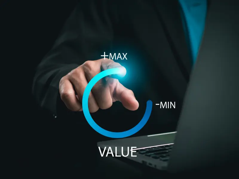 A person interacting with a digital interface. The interface displays a circular dial with labels for maximum and minimum at the top and bottom, respectively. which shows lmteq's value additions to its clients